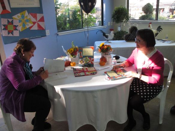 Diana Mc Clun and Laura Nownes signing books Diana Mc Clun and Laura Nownes signing books