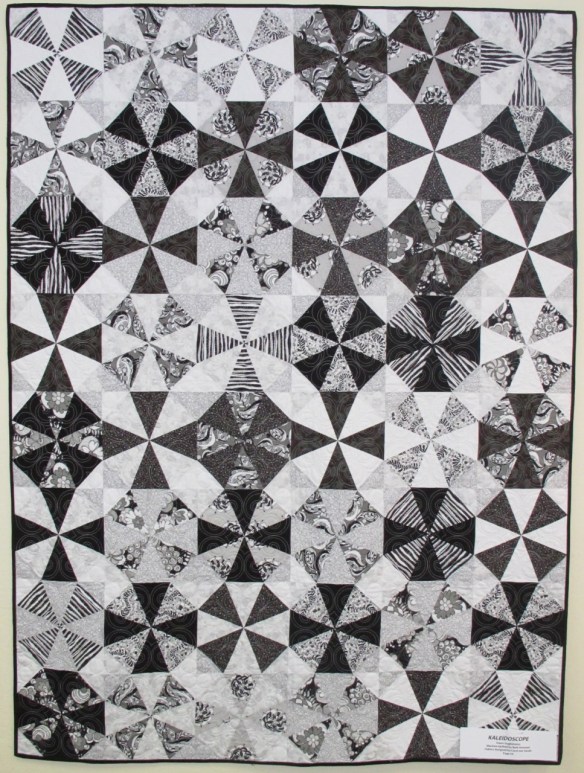Kaleidoscope by Dawn Guglielmino, quilted by Beth Hummel, fabrics "licorice Fizz" by Carol van Zandt, p. 54 of Quilts! Quilts!! Quilts!!! 3rd edition Kaleidoscope by Dawn Guglielmino, quilted by Beth Hummel, fabrics "licorice Fizz" by Carol van Zandt, p. 54 of Quilts! Quilts!! Quilts!!! 3rd edition