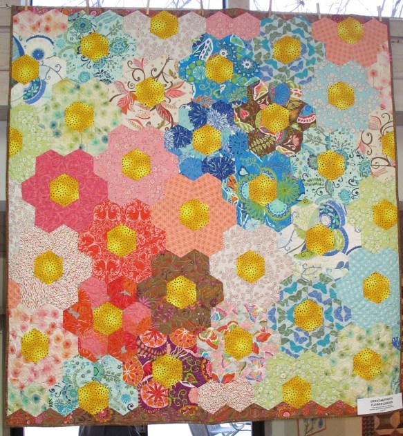 Grandmother's Flower Garden byMcClun and Laura Nownes, quilted by Victoria McEnerney with fabrics by Valori Wells, p. 64 in Quilts! Quilts!! Quilts!!! 3rd edition Grandmother's Flower Garden byMcClun and Laura Nownes, quilted by Victoria McEnerney with fabrics by Valori Wells, p. 64 in Quilts! Quilts!! Quilts!!! 3rd edition