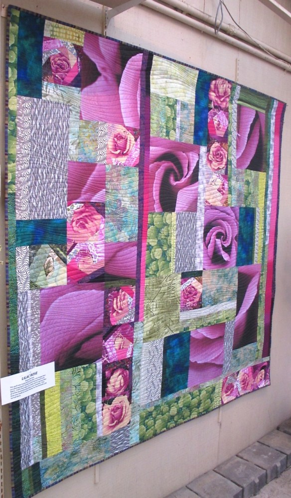 Lilac Rose by Diana McClun, for Kerby Smith, photographer of Quilts! Quilts!! Quilts!!! 3rd edition. The lilac rose image is a photograph by Kerby Smith that he printed onto fabric. Lilac Rose by Diana McClun, for Kerby Smith, photographer of Quilts! Quilts!! Quilts!!! 3rd edition. The lilac rose image is a photograph by Kerby Smith that he printed onto fabric.