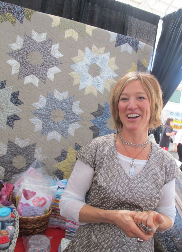 Jennifer Sampou in front of Daybreak Quilt by Jaybird Quilts using the Shimmer fabric collection by Jennifer Sampou for Robert Kaufman Jennifer Sampou in front of Daybreak Quilt by Jaybird Quilts using the Shimmer fabric collection by Jennifer Sampou for Robert Kaufman
