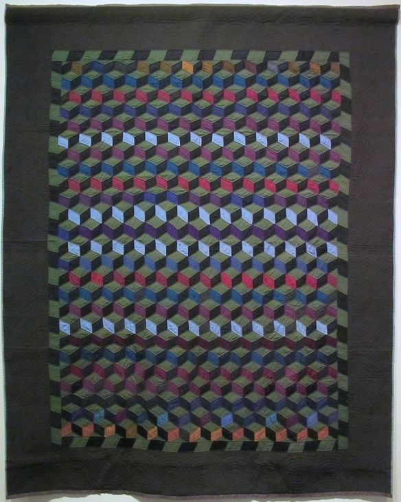 Tumbling Blocks, c. 1900-10. Ann K. Yoder, formerly from Lancaster County, Pennsylvania. Purchased from Sam E. Hershberger. Holmes County. Wool. Tumbling Blocks, c. 1900-10. Ann K. Yoder, formerly from Lancaster County, Pennsylvania. Purchased from Sam E. Hershberger. Holmes County. Wool.