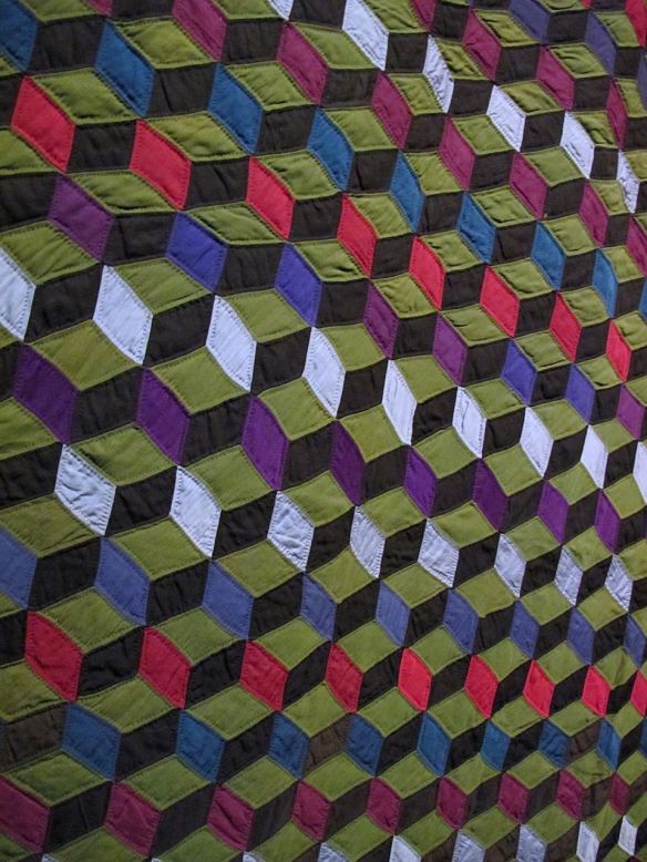 Tumbling Blocks, c. 1900-10. Ann K. Yoder, formerly from Lancaster County, Pennsylvania. Purchased from Sam E. Hershberger. Holmes County. Wool.