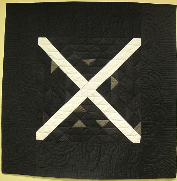 X by Stacey Sharman, 2014. Cotton, linen, wool, denim, and upholstery samples. Machine and hand quilted. X by Stacey Sharman, 2014. Cotton, linen, wool, denim, and upholstery samples. Machine and hand quilted.