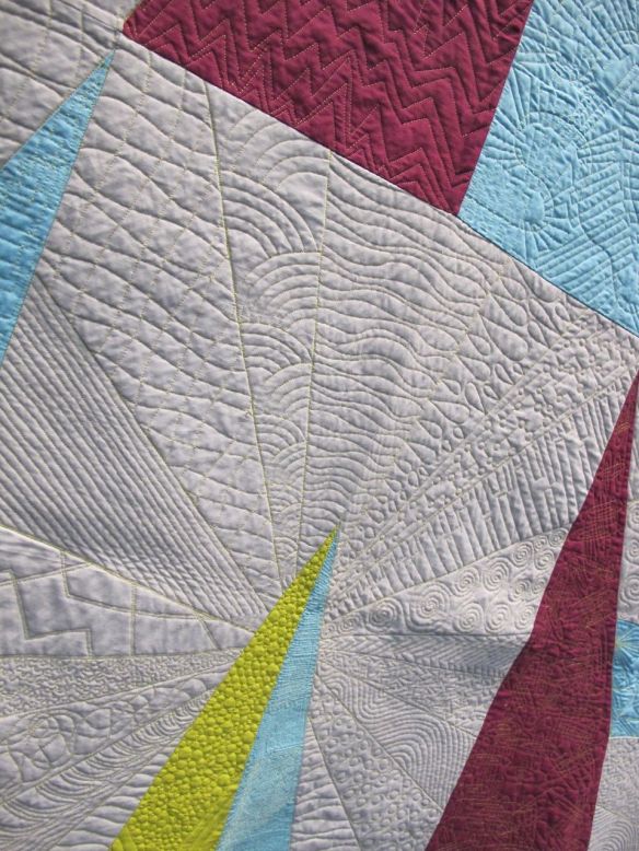 QuiltCon charity quilt, "Temporal Shift" by Essex County Modern Quilt Guild in Windsor, Ontario, Canada. Original design and quilting by Adrian Hansen-Kelly, collaboratively pieced by the guild. QuiltCon charity quilt, "Temporal Shift" by Essex County Modern Quilt Guild in Windsor, Ontario, Canada. Original design and quilting by Adrian Hansen-Kelly, collaboratively pieced by the guild.