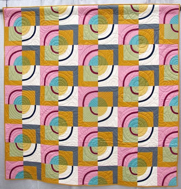 Orbits by Amy Stevenson. Ann Arbor, Michigan. Quilted by Kathy Koch of Thread Bear Quilting. Pattern available though Pink Castle Fabrics.
