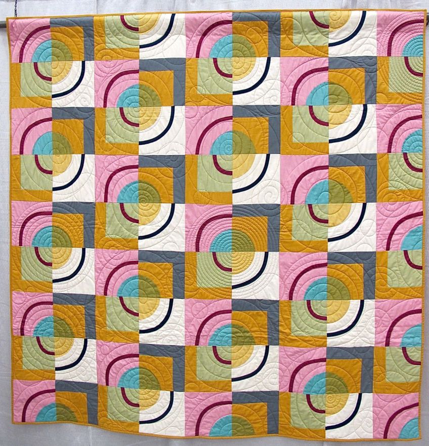 Orbits by Amy Stevenson. Ann Arbor, Michigan. Quilted by Kathy Koch of Thread Bear Quilting. Pattern available though Pink Castle Fabrics.