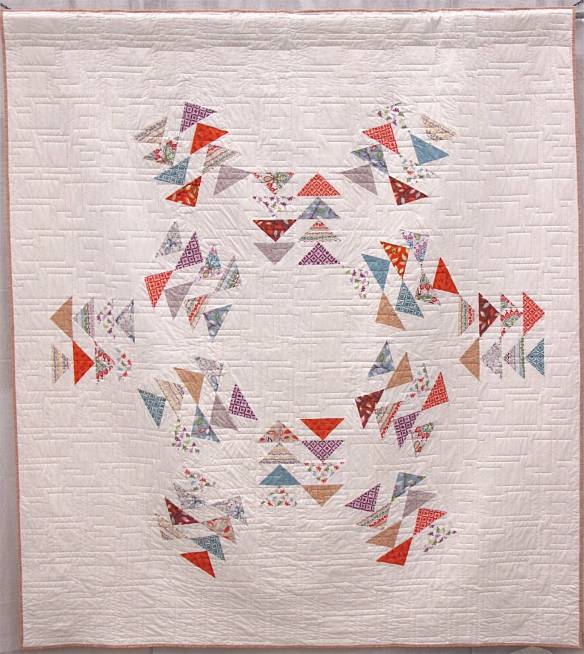 Modern Migration by Erin Davis. Evanston, Illinois. Pieced by Erin Davis, Jaclyn Barlett, Karri Garza, Mallory White, Caryn Carson, Sabrina Krueger, karen Paschke, Jill Randel, Julie Burkholder, Stacey Napier, Anna Gering. Quilted by Melissa Kelley @Sew Shabby Quilting.