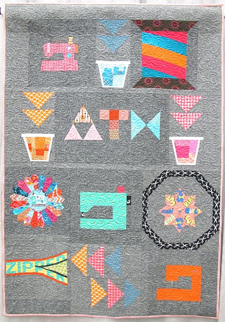 UFO Challenge by Heather Grant, pieced byCorinne Sovey, BethChinderle, Jill Ivie, Emily Thompson, Christs Carew, Mary Anne Williams, Angela Milliman, Gina Pina, Kim Place. Quilted by Gina Pina.