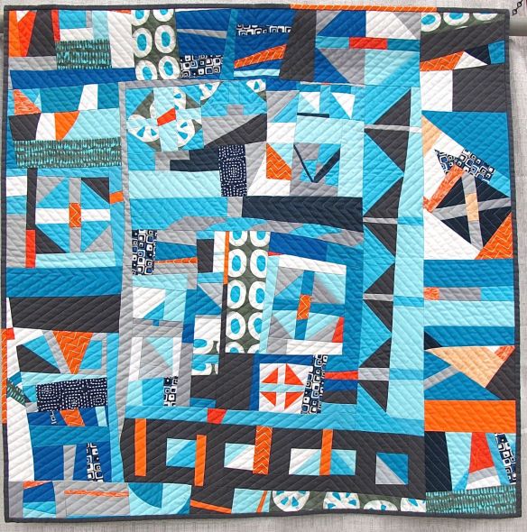 Churn Dash 2: Complementary by Martha Peterson. Woodinville, Washington. Pieced by Deborah Ferguson and Chandra Wu. 2nd place Group or Bee Quilts, QuiltCon 2015.