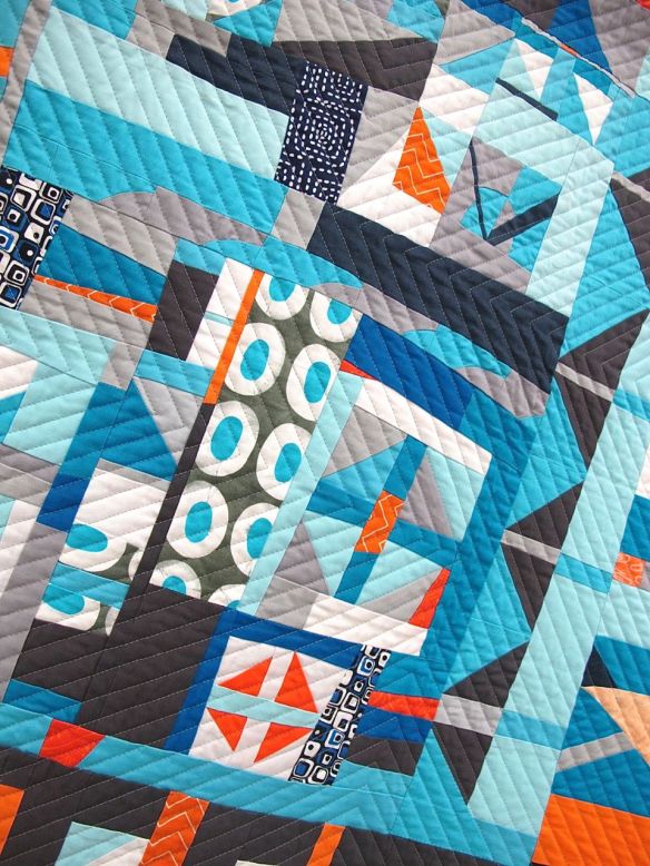 Churn Dash 2: Complementary by Martha Peterson. Woodinville, Washington. Pieced by Deborah Ferguson and Chandra Wu. 2nd place Group or Bee Quilts, QuiltCon 2015.