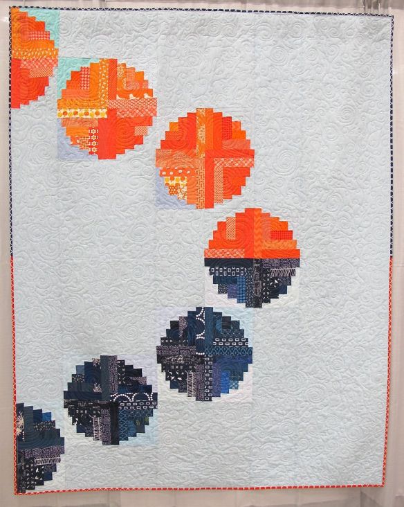Eclipse. Bellevue, Kentucky. Pieced by Hope Circle: Afton Warrick, Cath Hall, Christie Kline, Ellen McKee, Heather Pegel, Kim Soper, Kimberly Swick, Melanie Hughes, Suzy Lampman. Quilted by Ellen McKee. Use of curved blocks in spired by "Log Cabin beads" by Kathy Hamada.