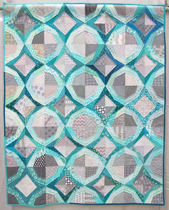 Icicles. Portland, Oregon. Pieced by Cath Hall, Ellen McKee, Suzy Lampman, Melanie Hughes, Nicole Boone, Kimberly Swink, Natalie, Weaver. Quilted by Cath Hall. Design Source: Paper piecing pattern Icky Thump by Julie Hirt of 627Handworks.