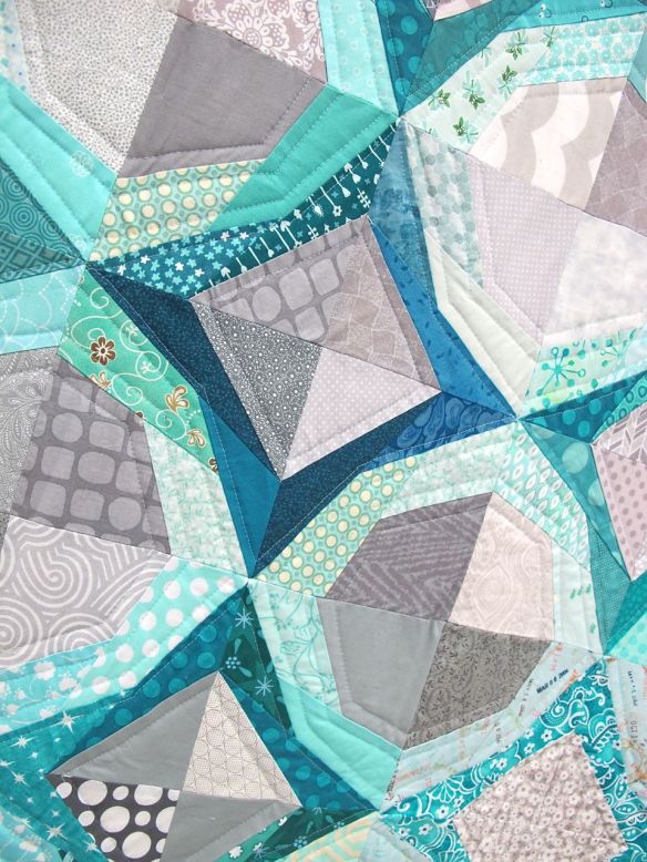 Icicles. Portland, Oregon. Pieced by Cath Hall, Ellen McKee, Suzy Lampman, Melanie Hughes, Nicole Boone, Kimberly Swink, Natalie, Weaver. Quilted by Cath Hall. Design Source: Paper piecing pattern Icky Thump by Julie Hirt of 627Handworks.