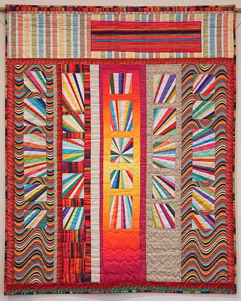 Sun Shine by Sharona Fischrup, quilted by New Pieces Quilt Shop