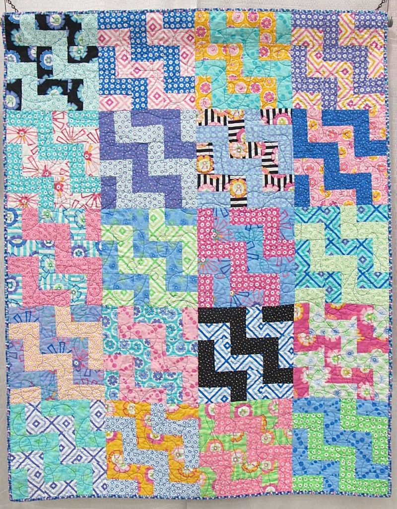 Staircase by Kate Ivie, Austin, Texas. Pattern: "Social Climber" from Villa Rosa Designs.Started at age 10. Quilted by Evie on a long-arm at The Cotton Cupboard in Lakeway, Texas. Binding by her mother, Jill Evie.