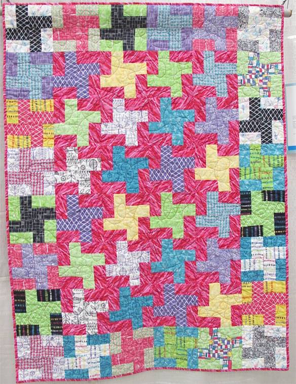 Pinwheels by Kate Ivie. Austin. Texas. Pattern, "Mardi Gras" from Villa Rosa Designs. Started ar age 9. Quilted on a long arm at The Cotton Cupboard in Lakeway, Texas.