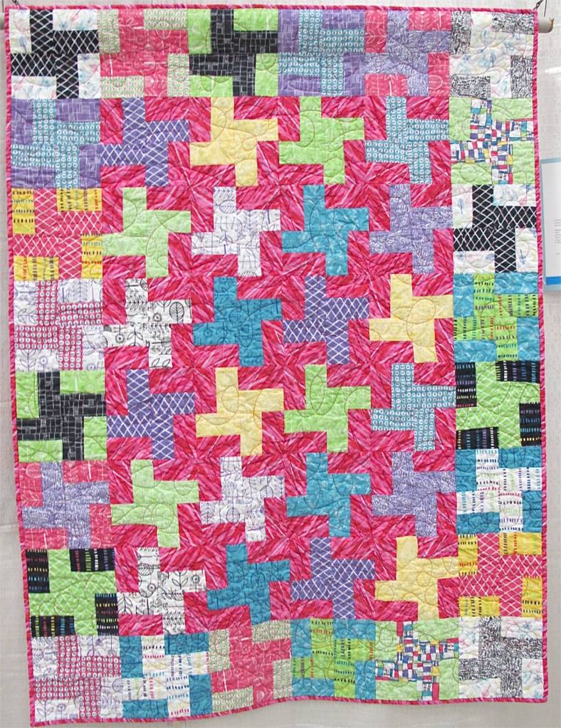 Pinwheels by Kate Ivie. Austin. Texas. Pattern, "Mardi Gras" from Villa Rosa Designs. Started ar age 9. Quilted on a long arm at The Cotton Cupboard in Lakeway, Texas.