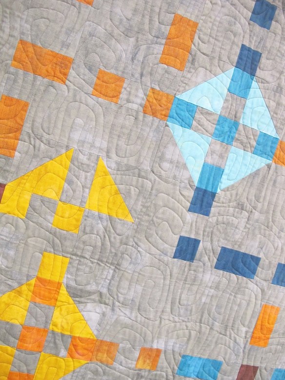 Churn Dash Boogie-Woogie by Mickey Beebe, quilted by Toni McAuliffe