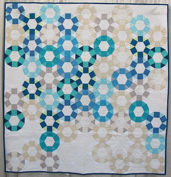 Cog by Emily Cier, quilted by Angela Walters Cog by Emily Cier, quilted by Angela Walters