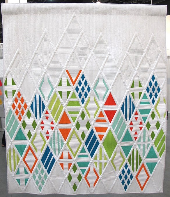 Eidos, designed by Agatha June of Austin, Texas, Pieced by Elizabeth Dackson of Tampa, Florida, quilted by Gina Pina of Austin, Texas. Eidos, designed by Agatha June of Austin, Texas, Pieced by Elizabeth Dackson of Tampa, Florida, quilted by Gina Pina of Austin, Texas.