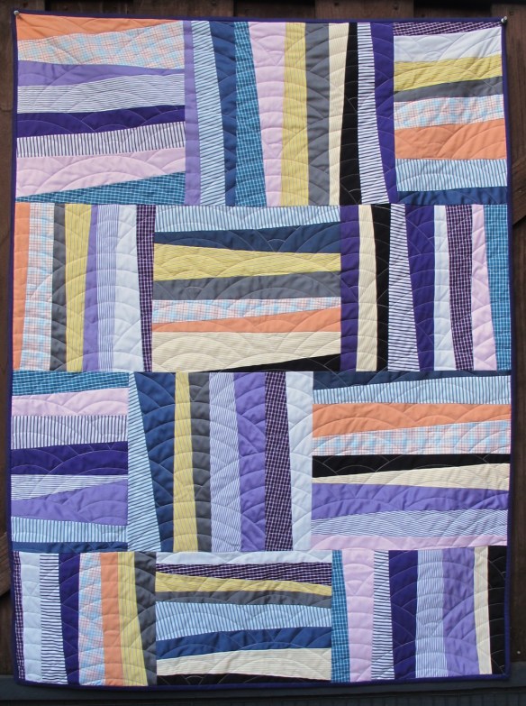 Shirt quilt by Carol Van Zandt. Quilting by Hello Stitch