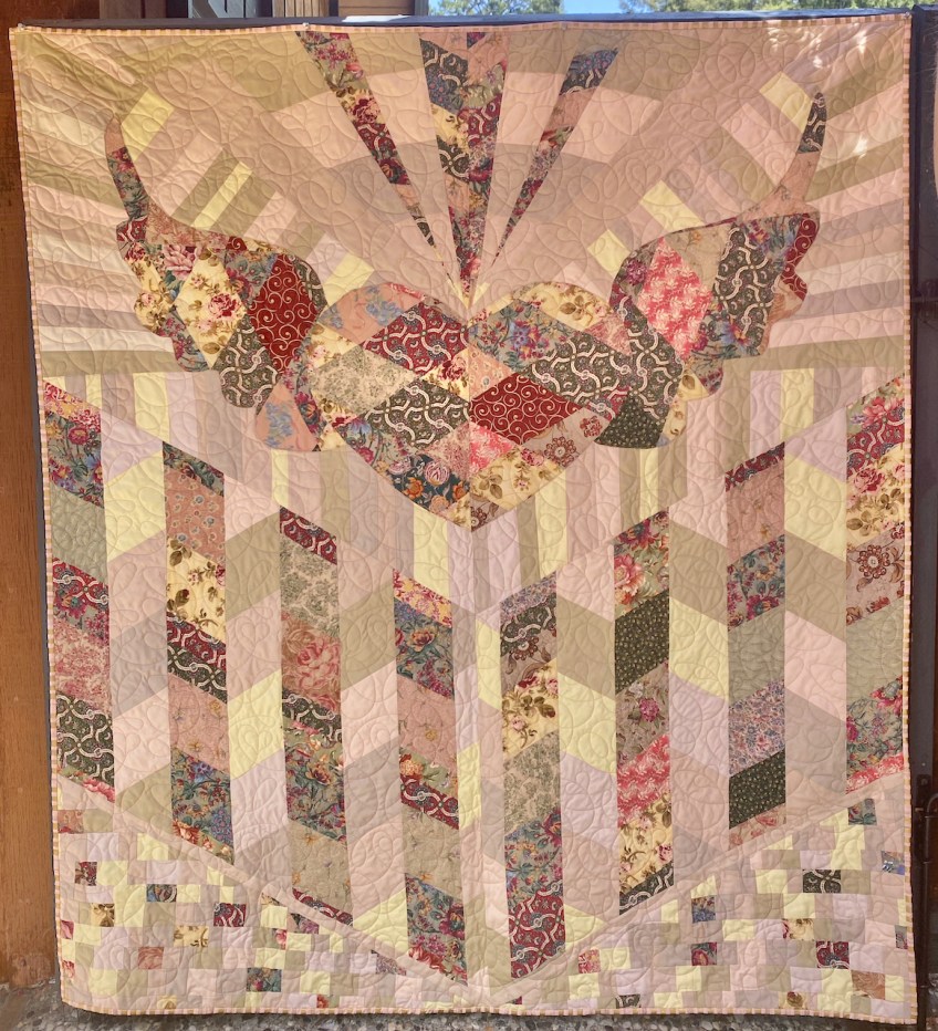 Mata's Wings by Narinjan Khalsa and Carol Van Zandt. Quilted by Hello Stitch. 72" x 64"
